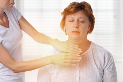 Woman having reiki healing treatment